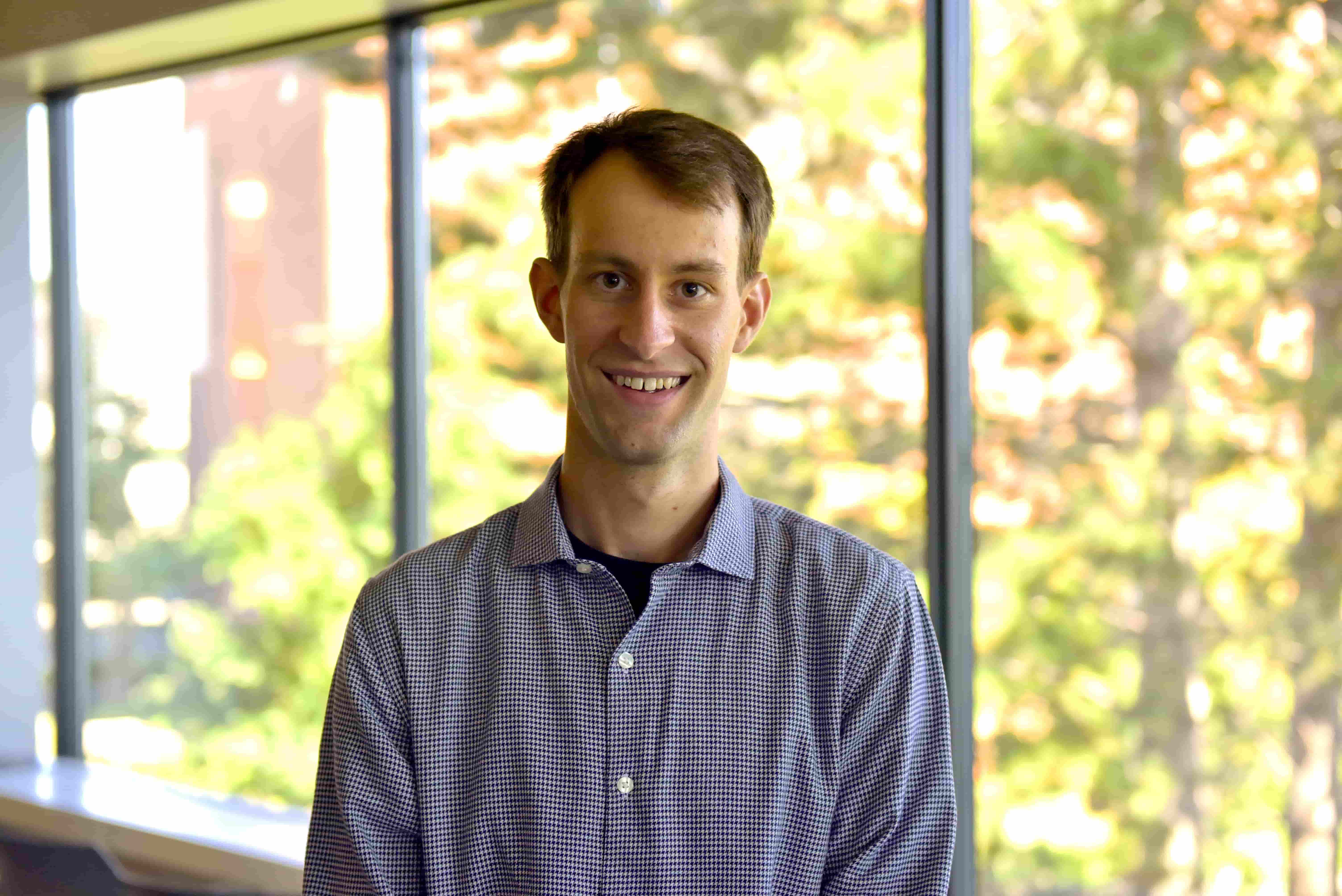 Matthew Picard Fraser  in blue shirt