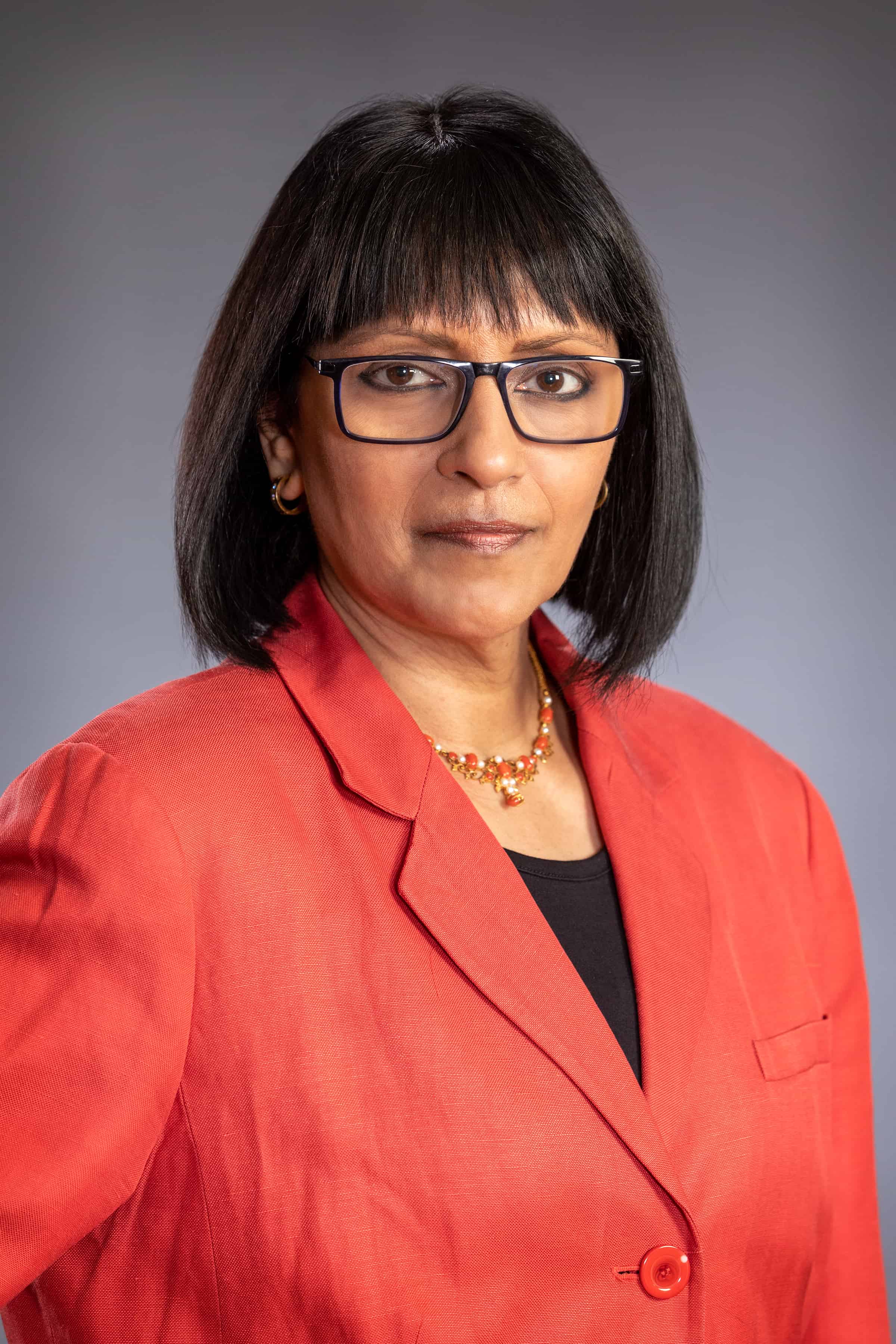 Subha Ramani in red blazer