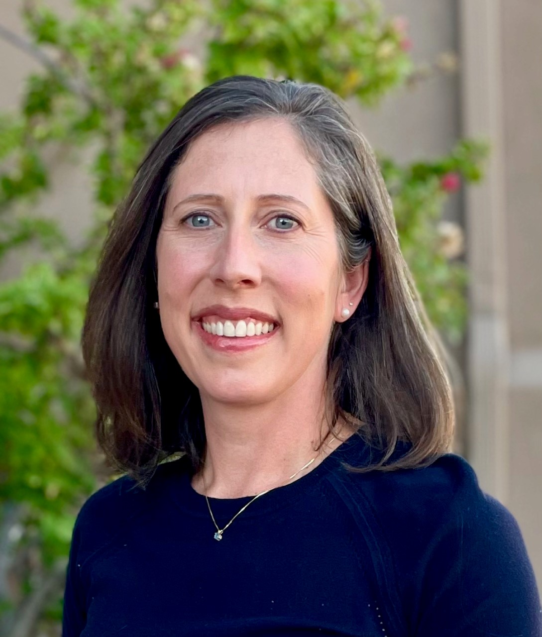 Outdoor headshot of a professor from the MGH IHP Doctor of Speech-Language Pathology program.