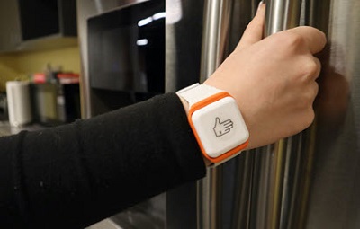 white sensor on a wrist looks like a big square watch