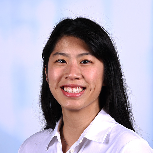 abby has straight black hair and a white collared shirt