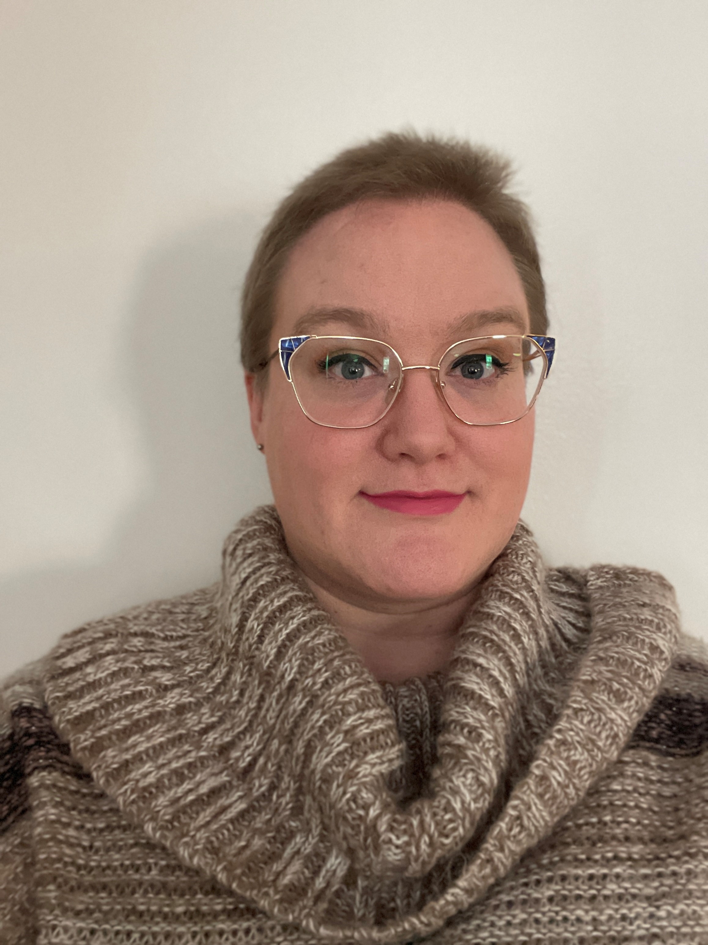katie wears cat eye gold rimmed glasses