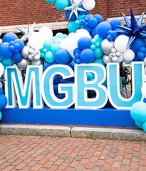 MGBU big letters surrounded by balloons