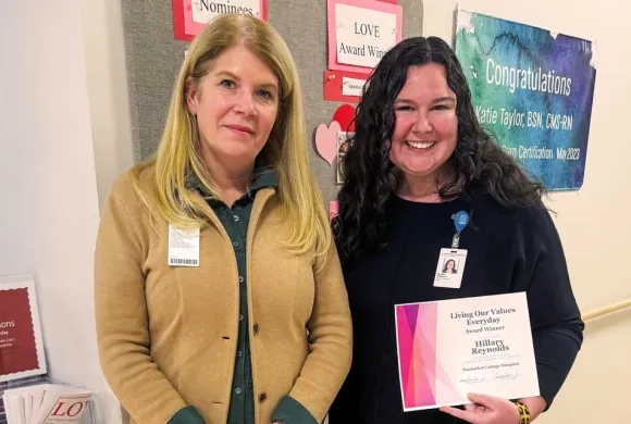 Nantucket Cottage President Amy Lee with Hillary Reynolds holding the L.O.V.E Award certificate 