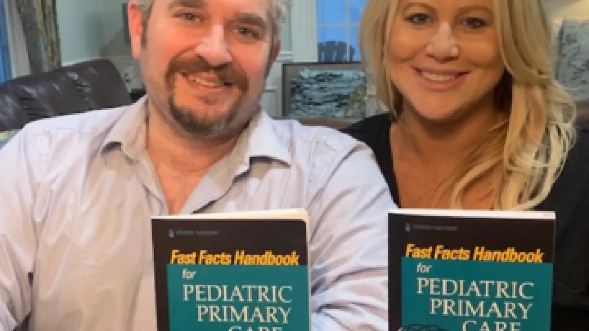 Mike and Kristine Ruggiero hold copies of their new textbook.