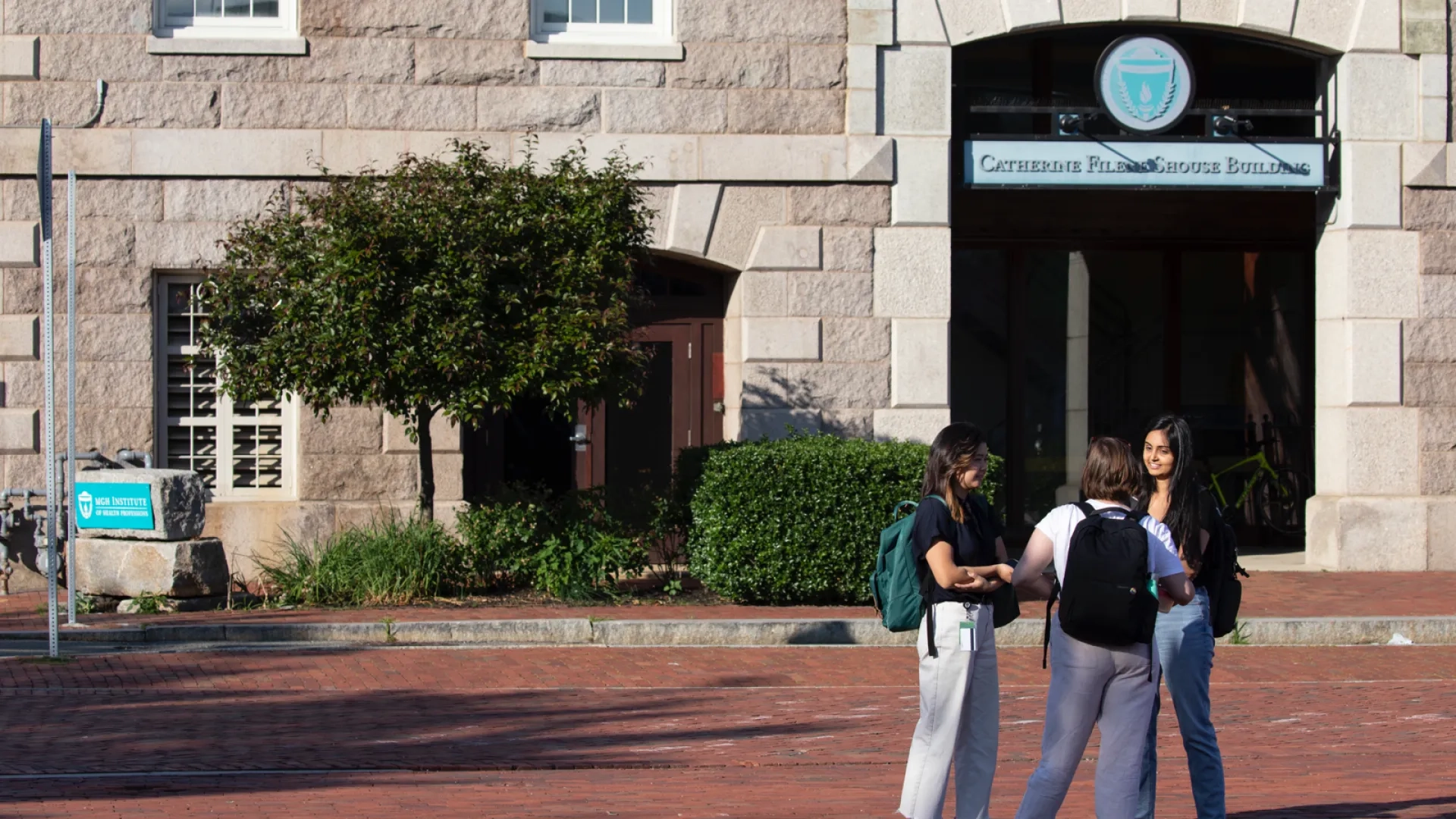 Students standing in front of a building enterance