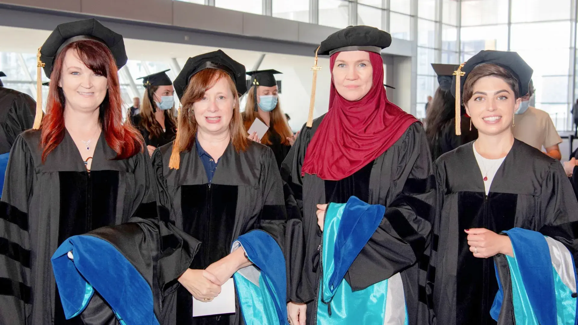 Dr. Dawn Wawersik, Dr. Maura Polansky, Dr. Cynthia Mosher, and Dr. Alex Morton are the first four graduates of the PhD in Health Professions Education program.at 2022 Commencement.