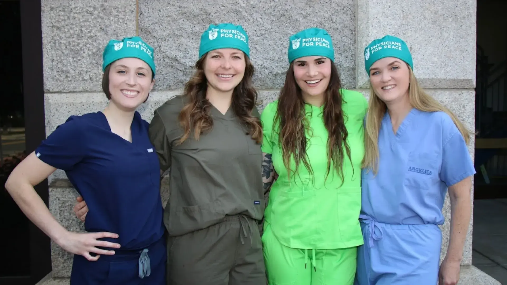 Students and faculty in scrubs