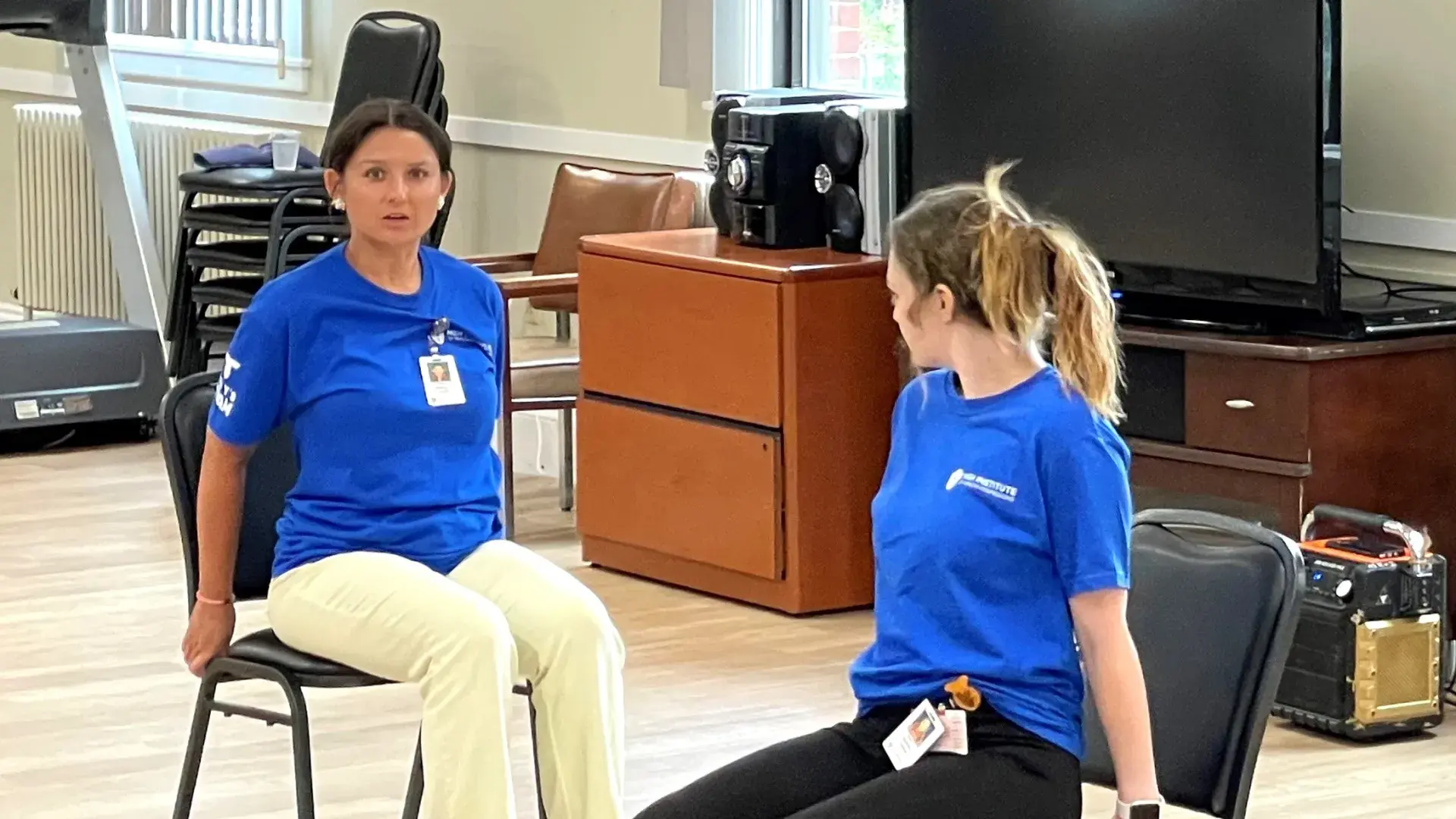 2 women on chairs
