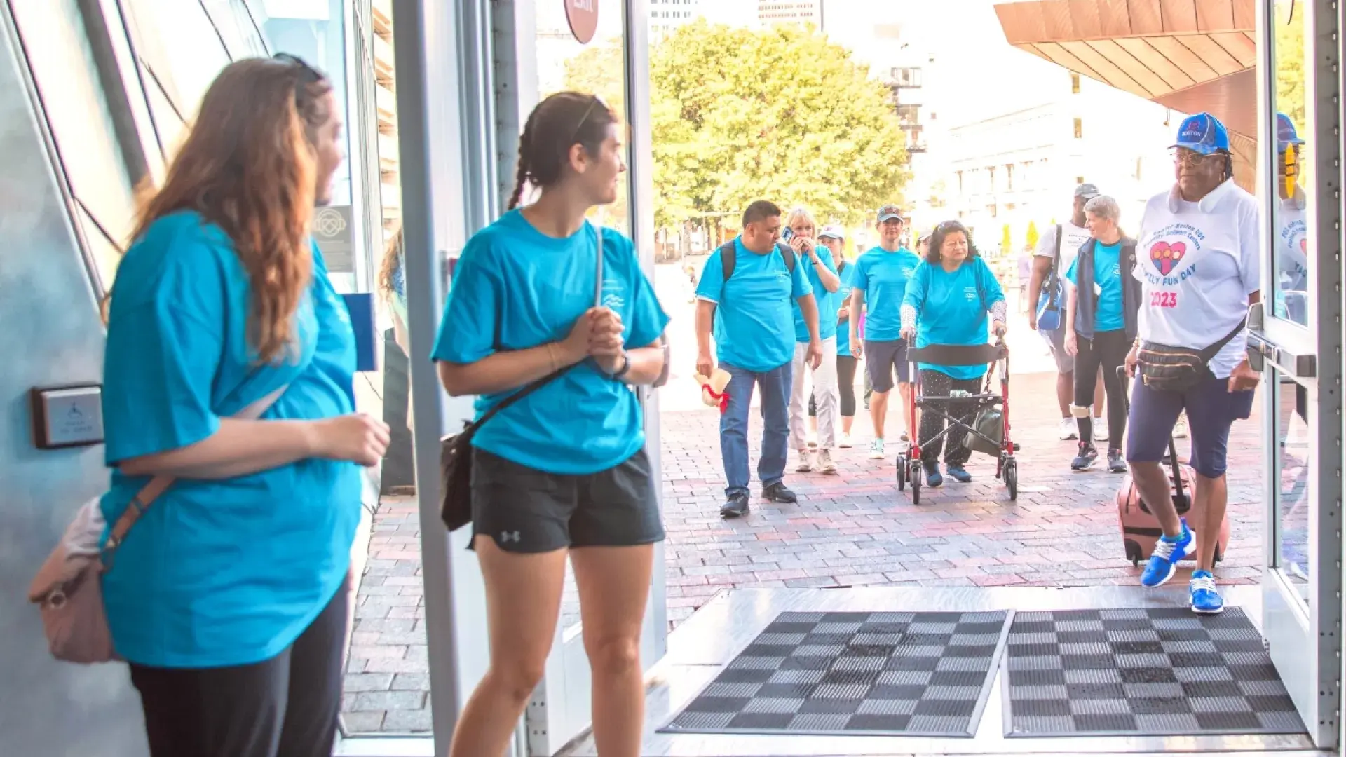People walking into the New England Aquarium