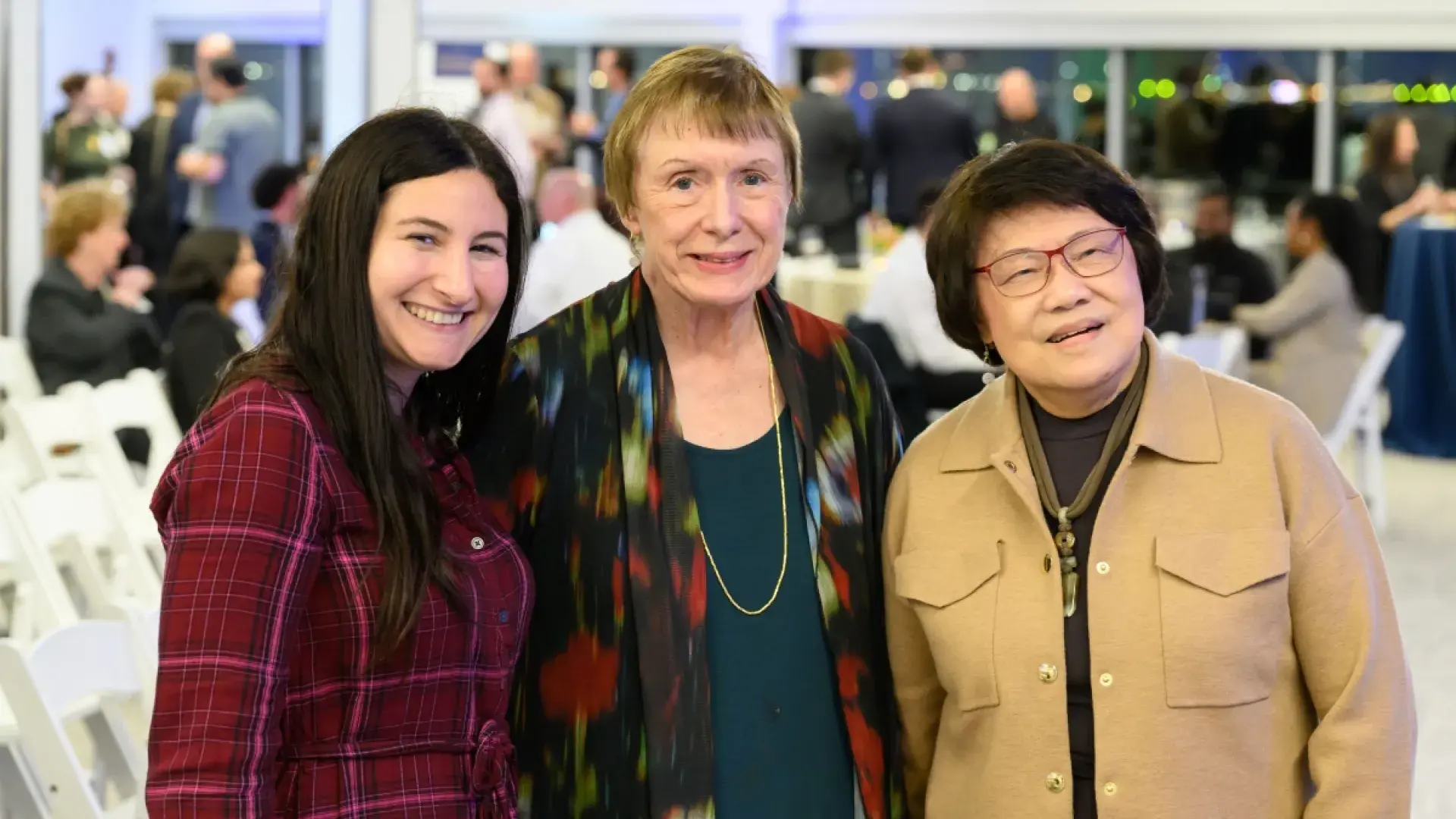 Three women smiling