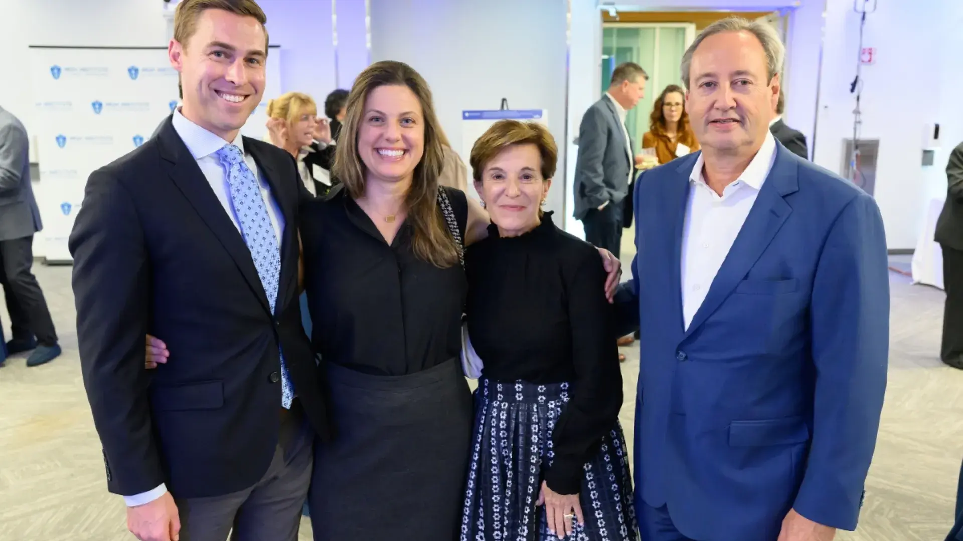Four people smiling