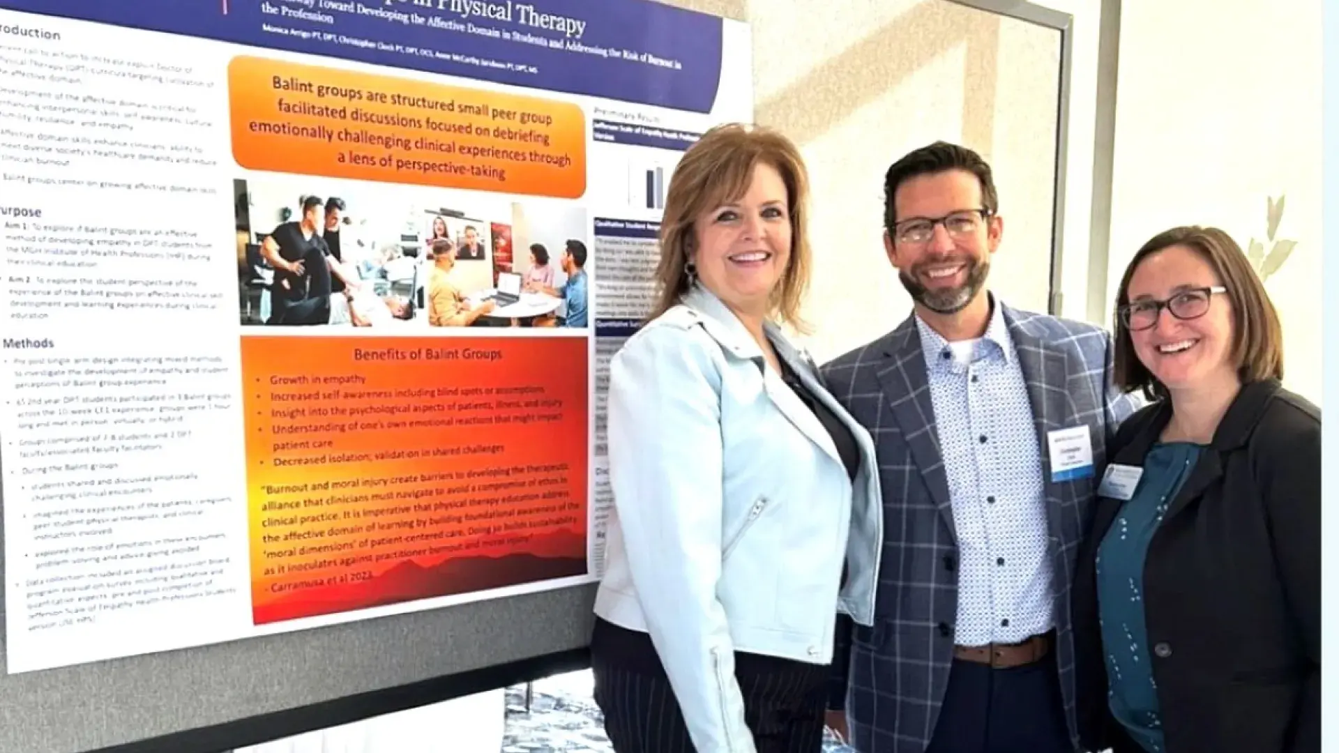 People in front of research poster