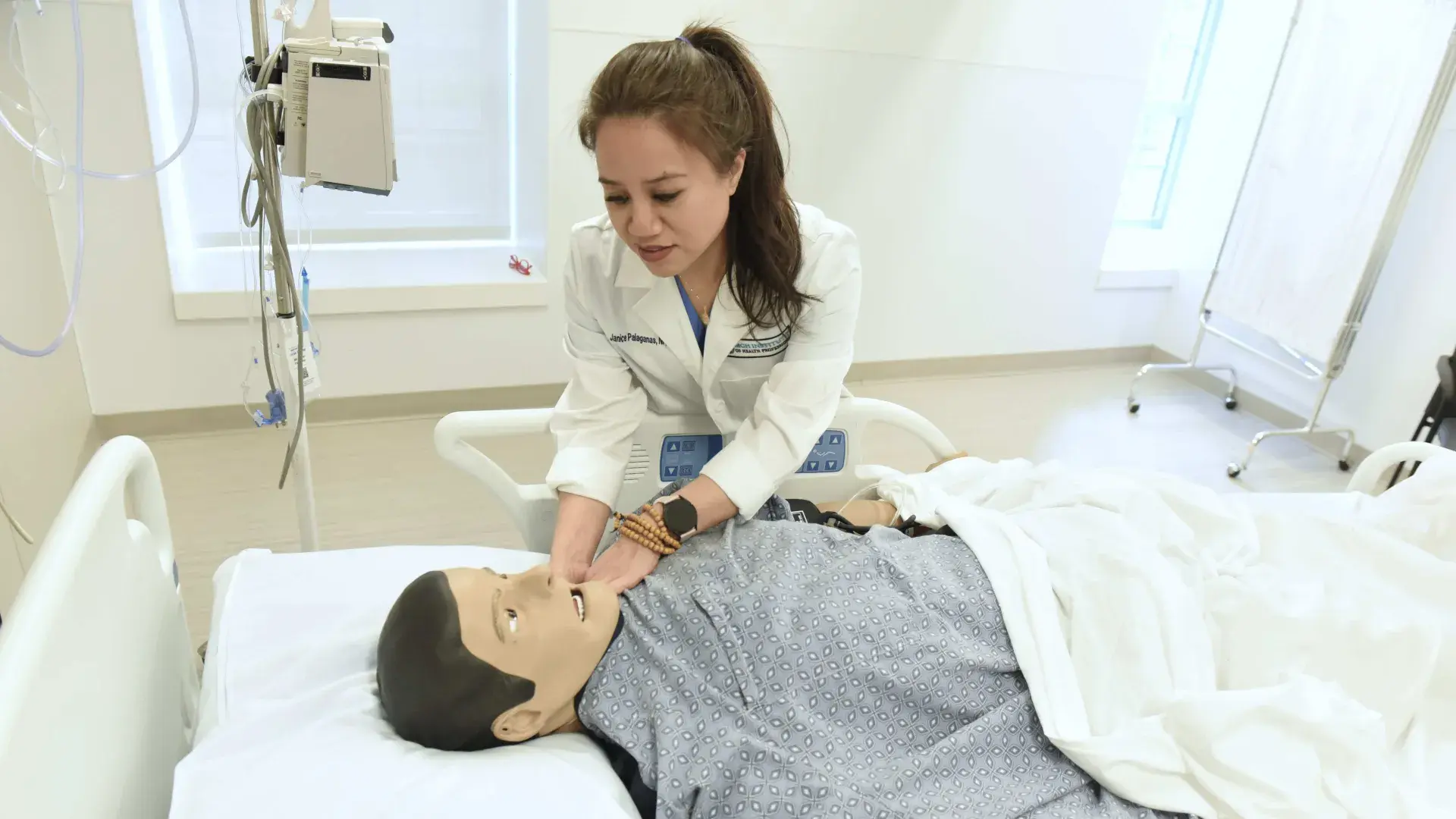 Woman working with a simulation manikin