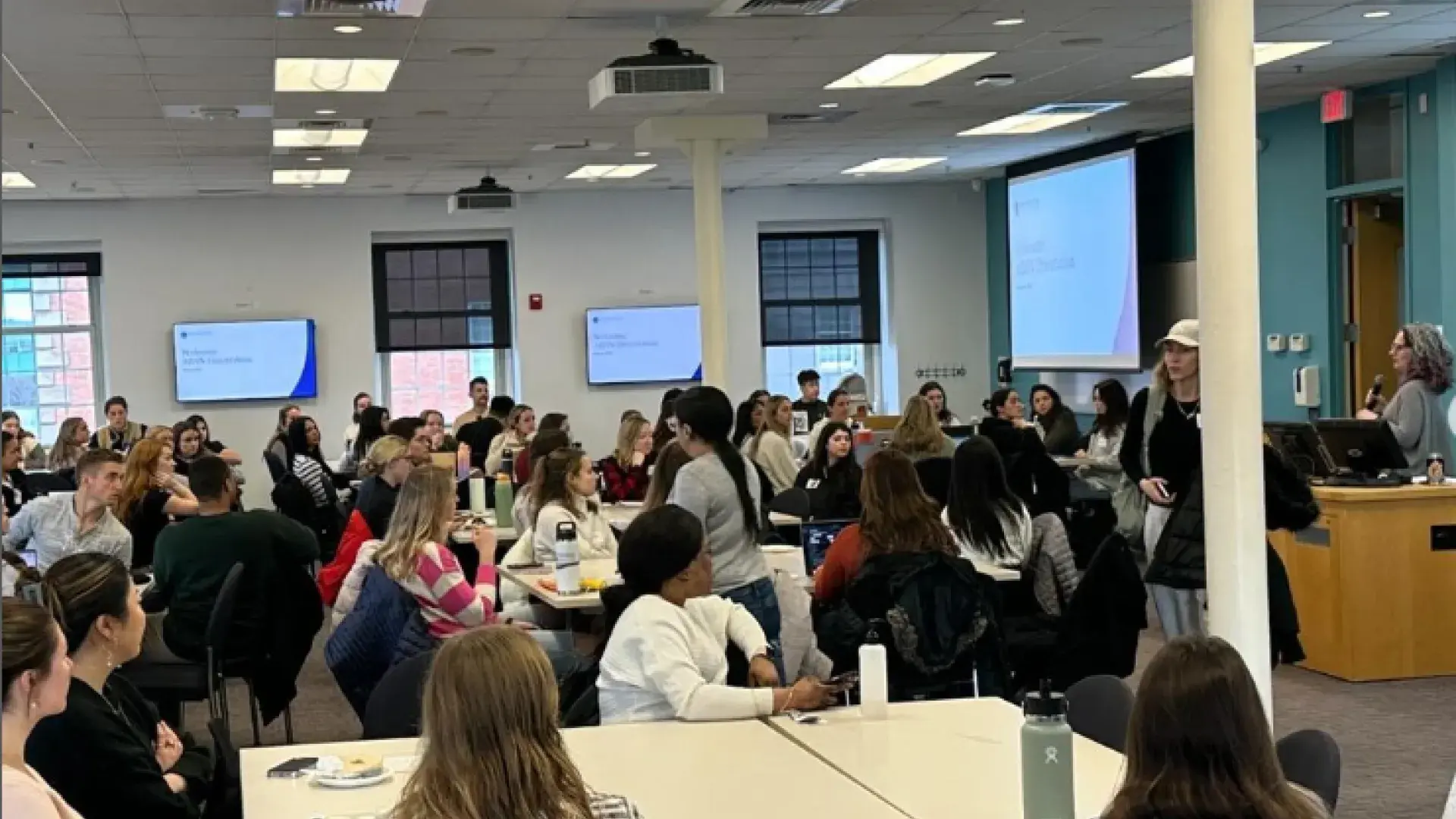 students sit in room