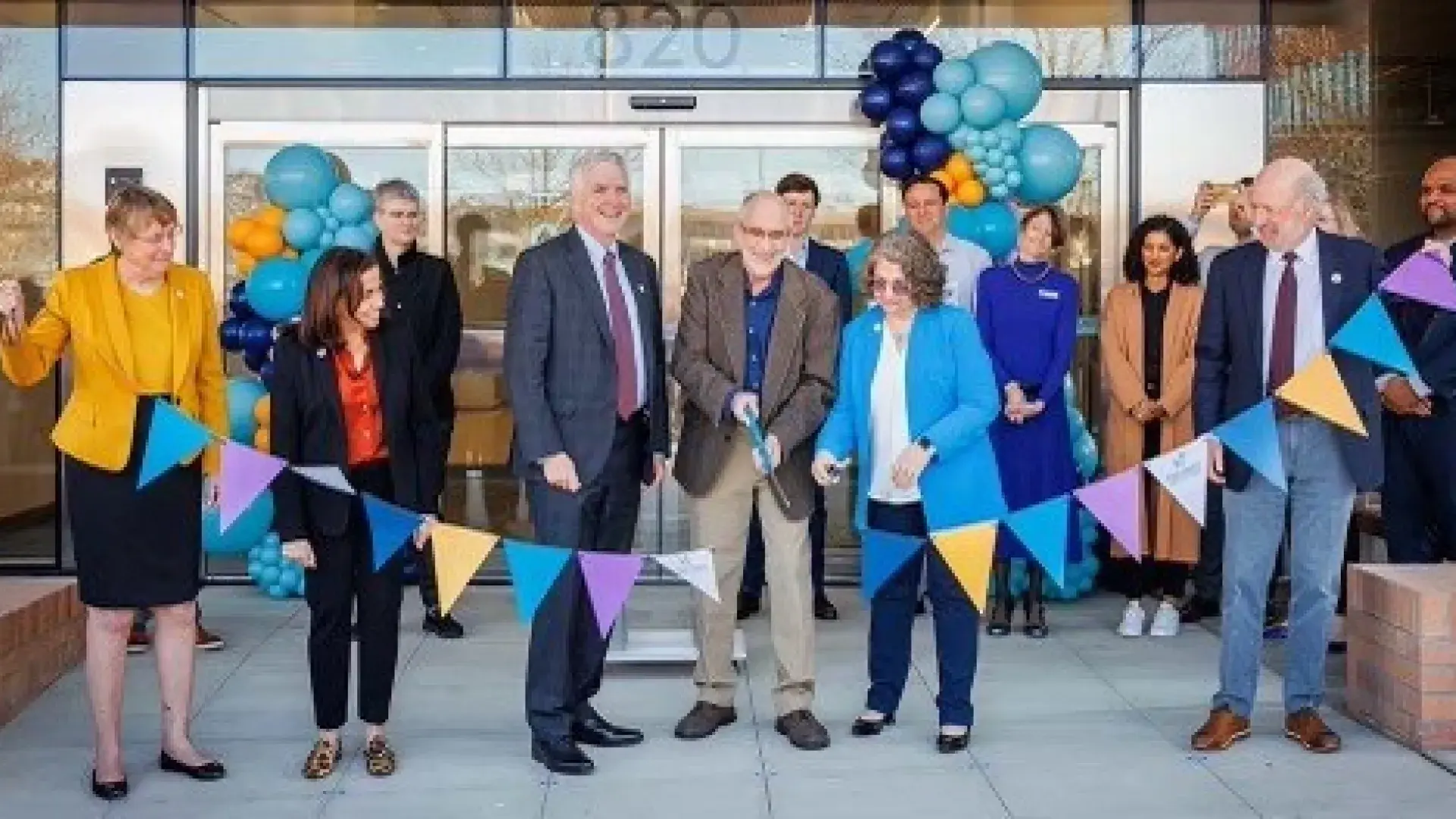 People doing a ribbon cutting