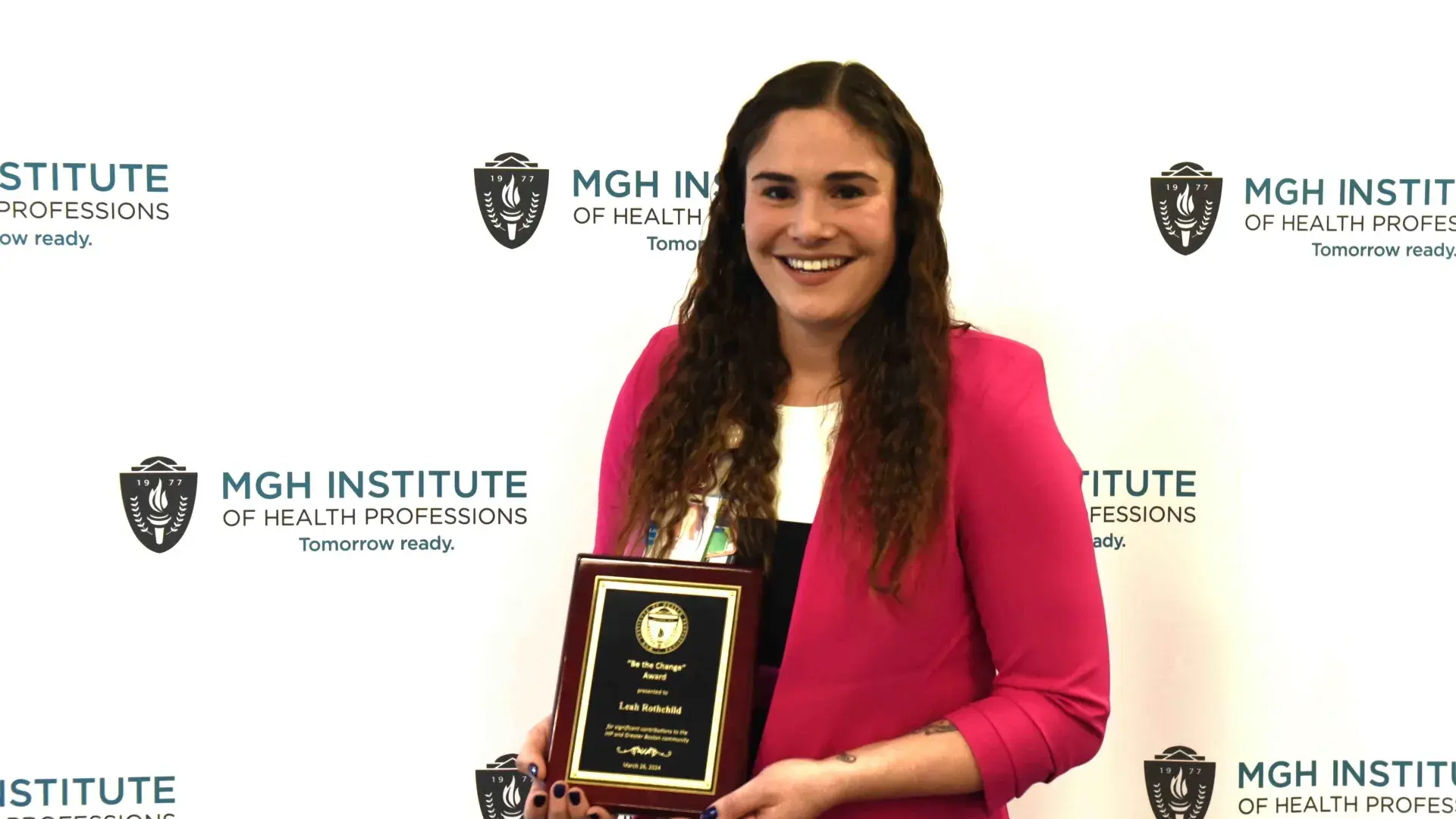 Person holds an award