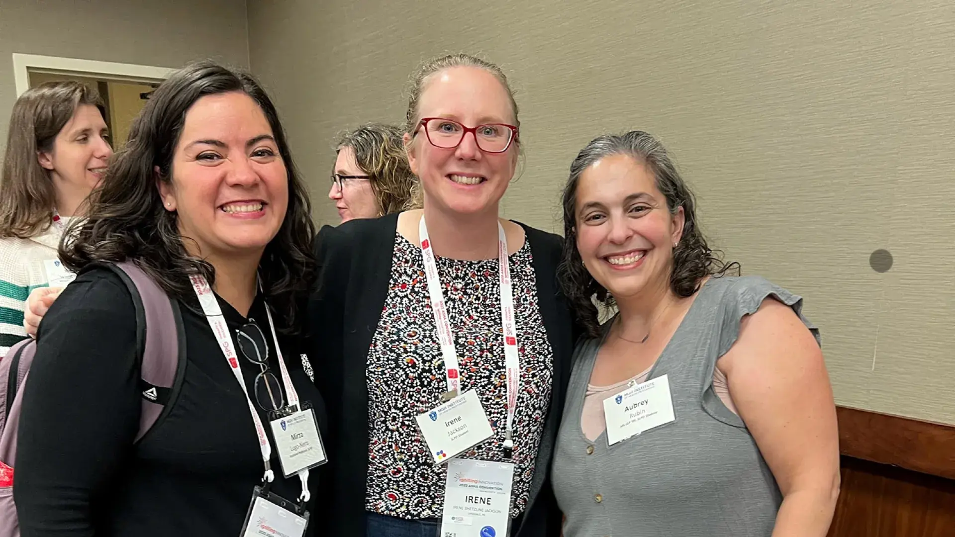 three women smile