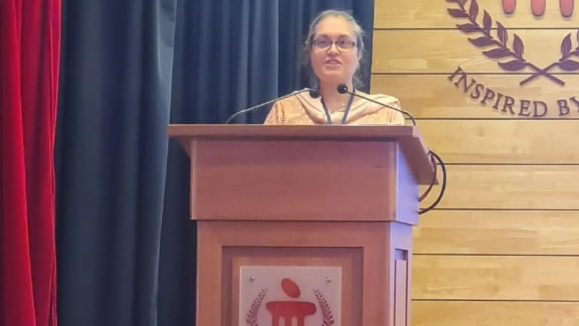 woman speaks at podium
