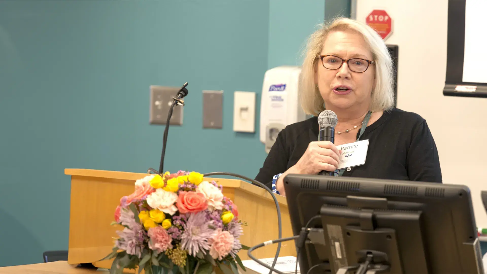 woman speaking at podium
