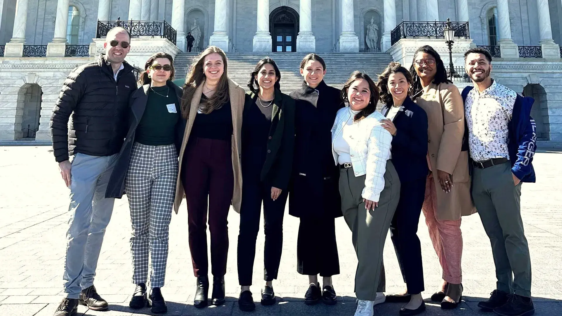 People standing in front of the US Capitol