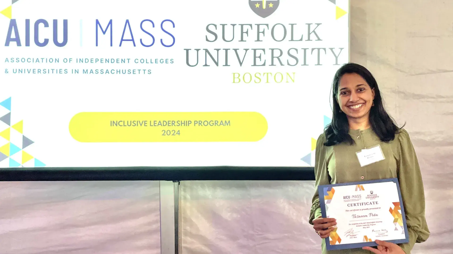 Woman smiling with an award