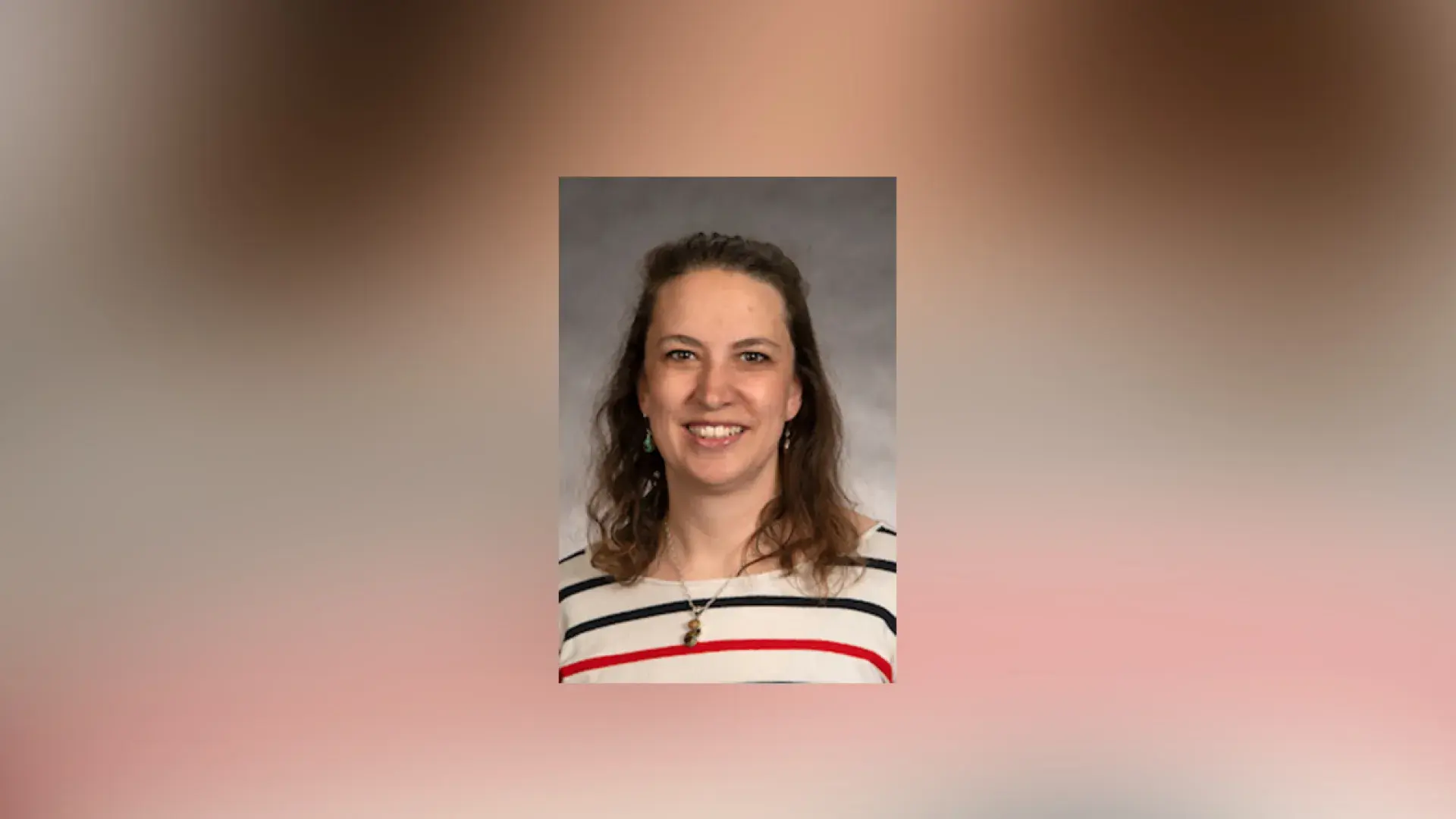 smiling woman in a striped top