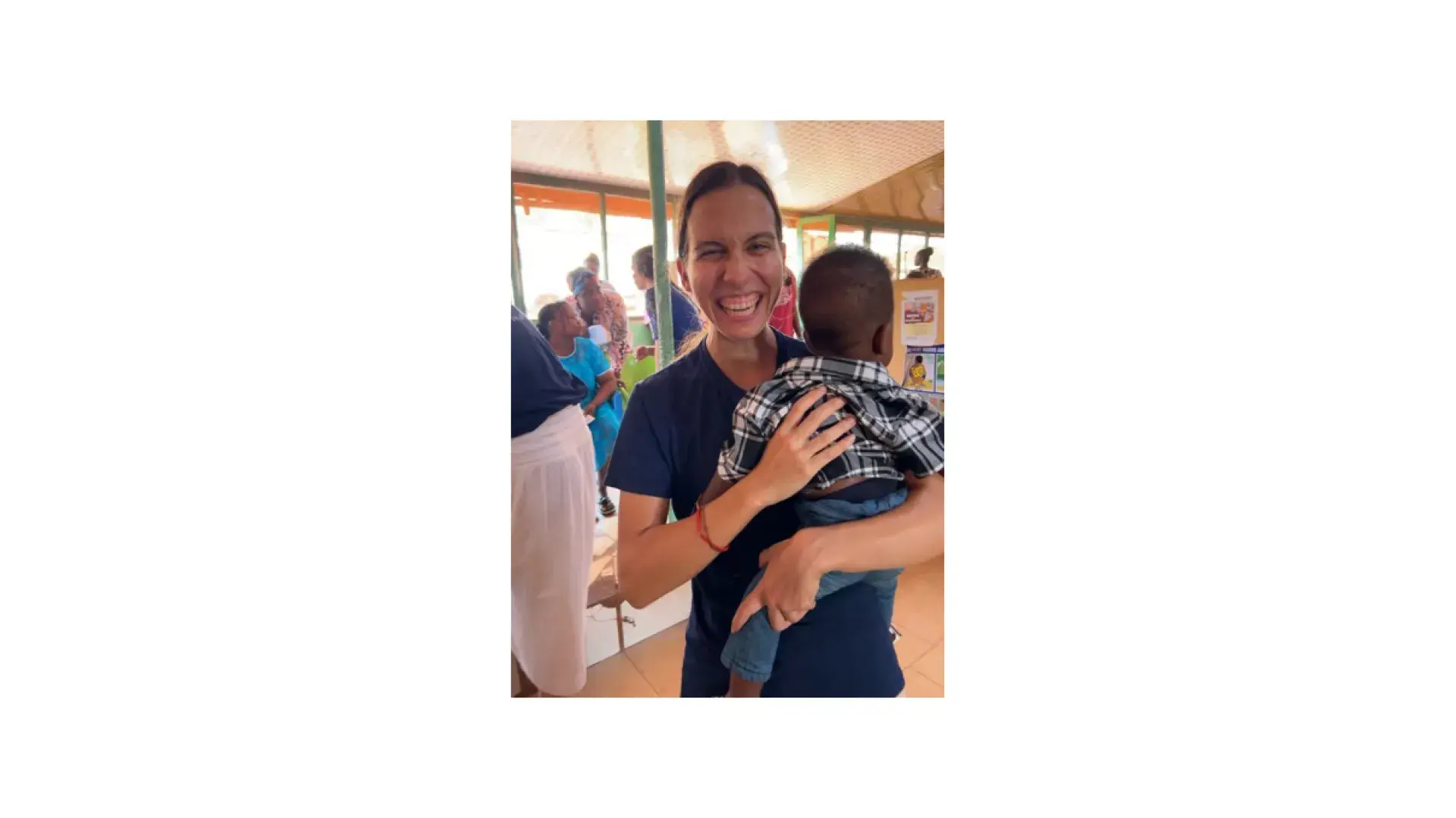 A woman holds a baby