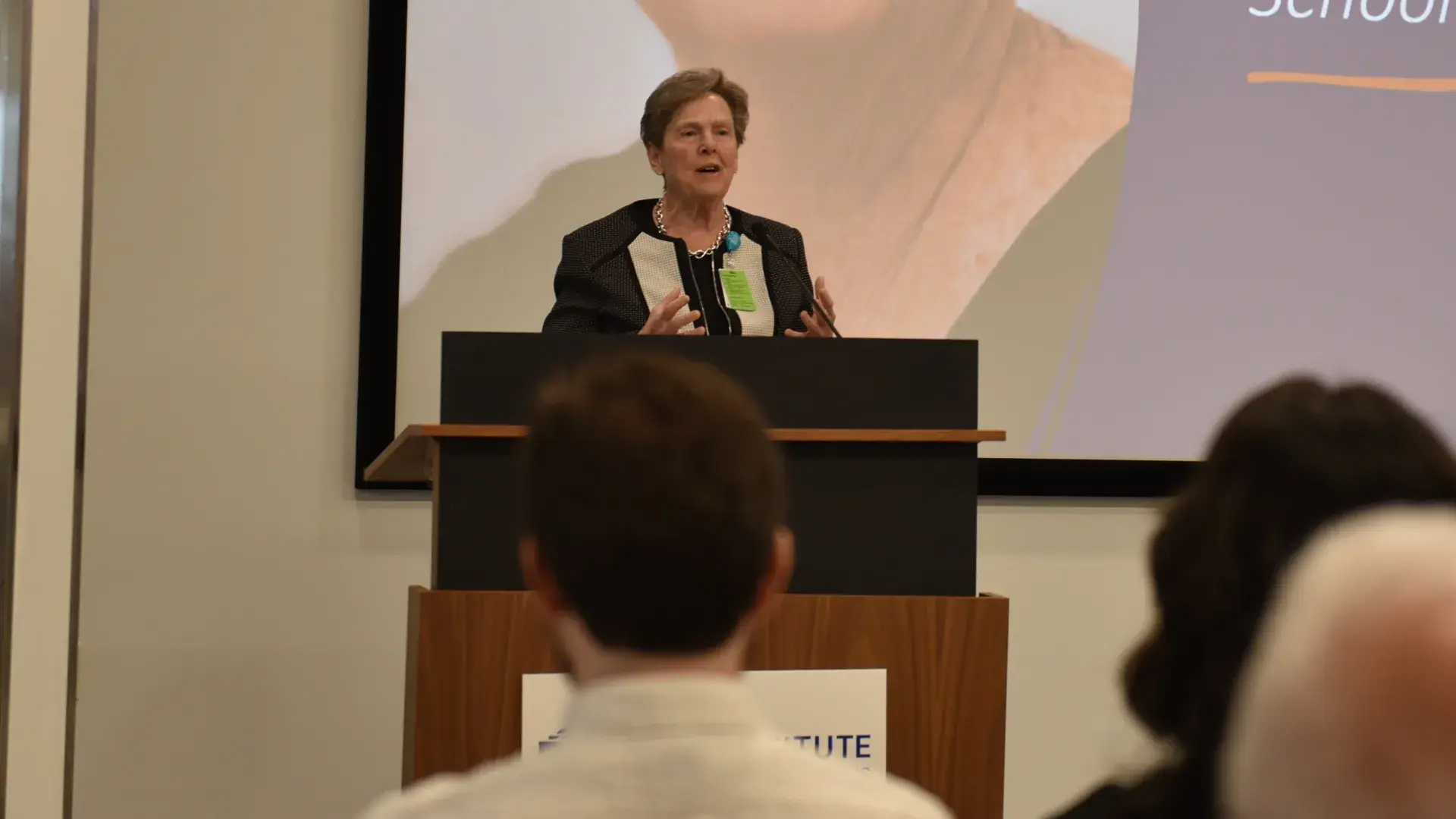 A photo of a woman at a podium