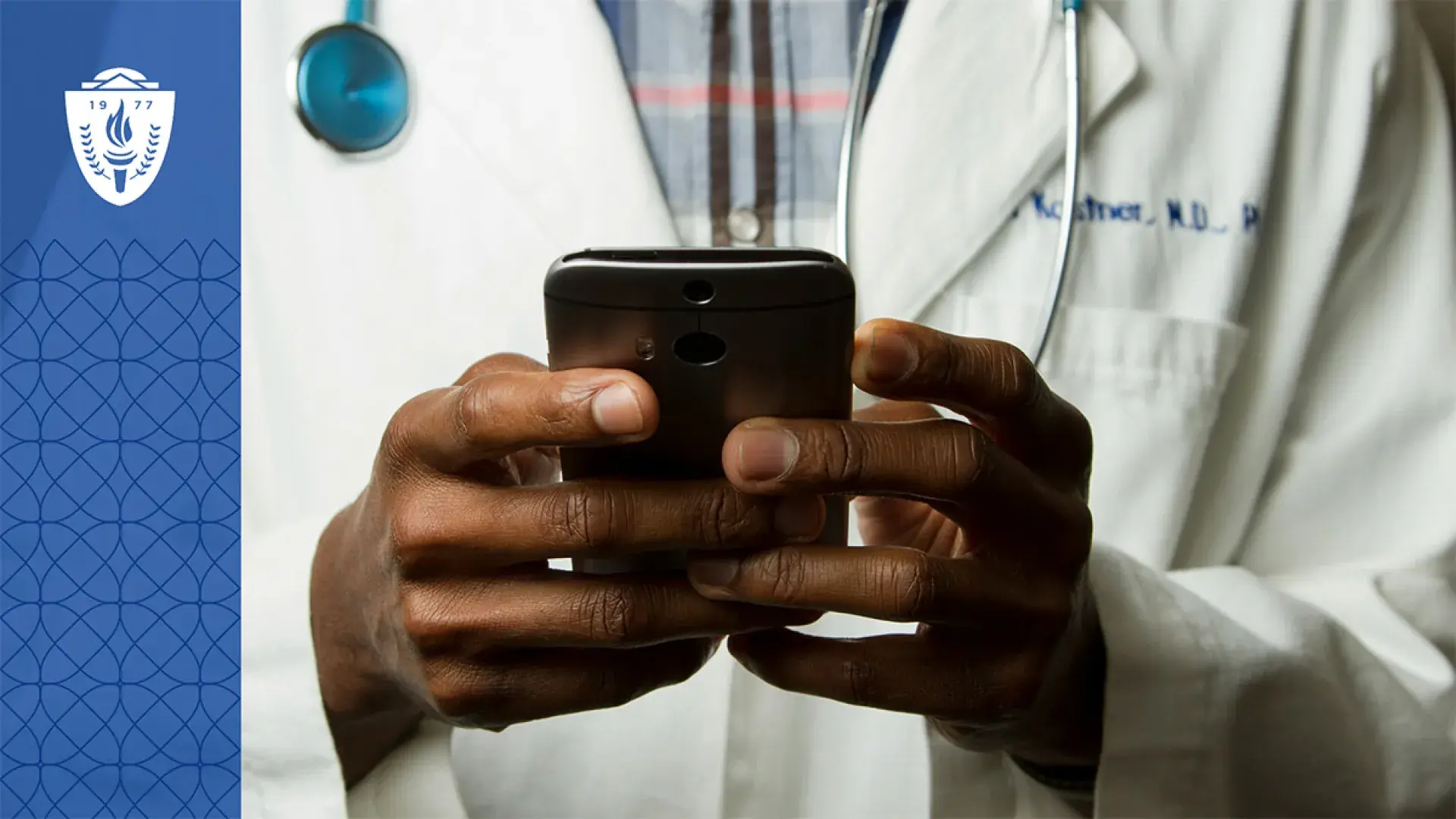 Close up of a doctor holding a smart phone in their hands.