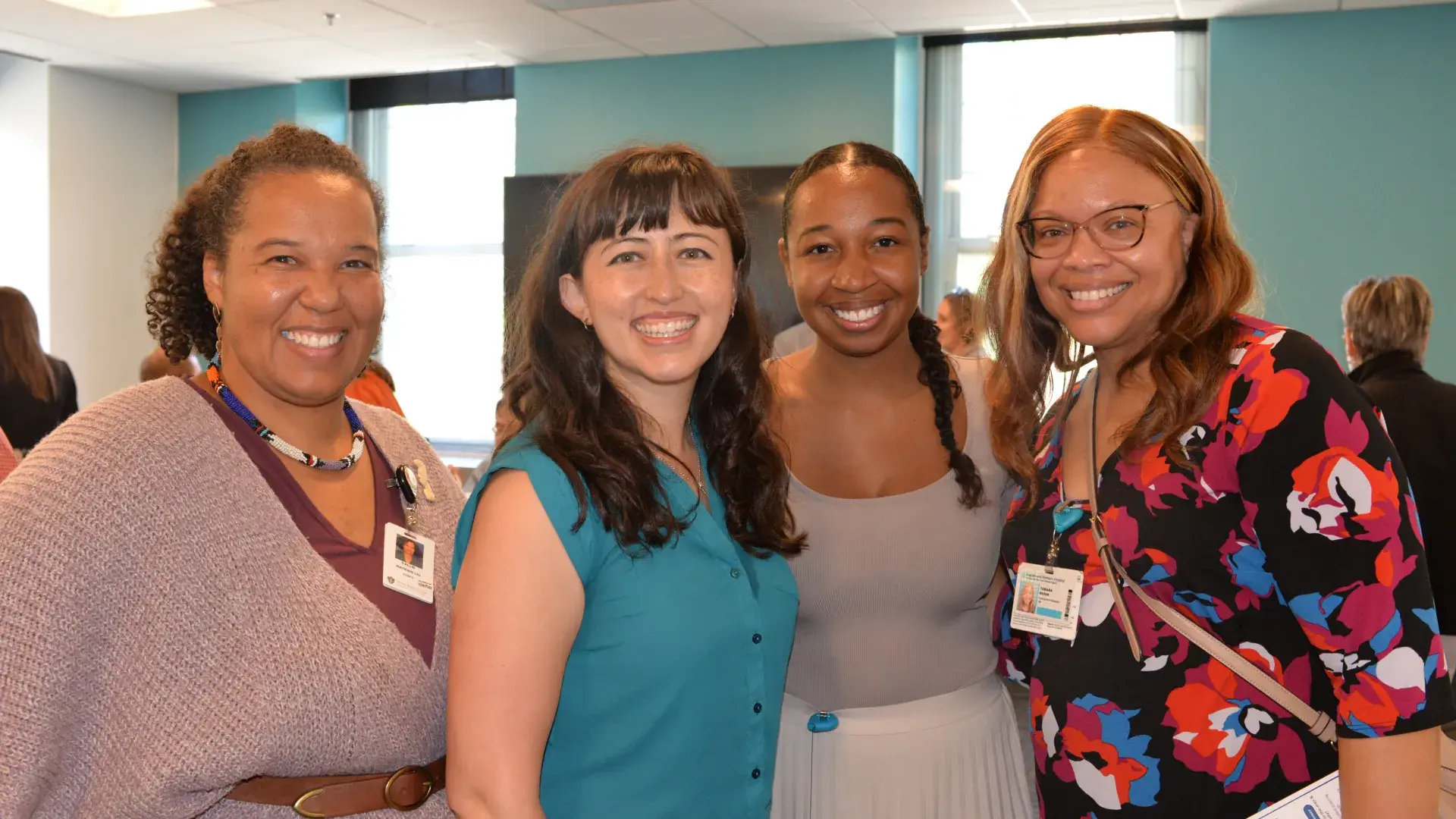 four women smiling 