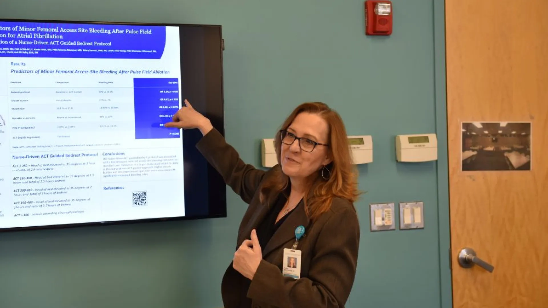 woman standing in front of a screen