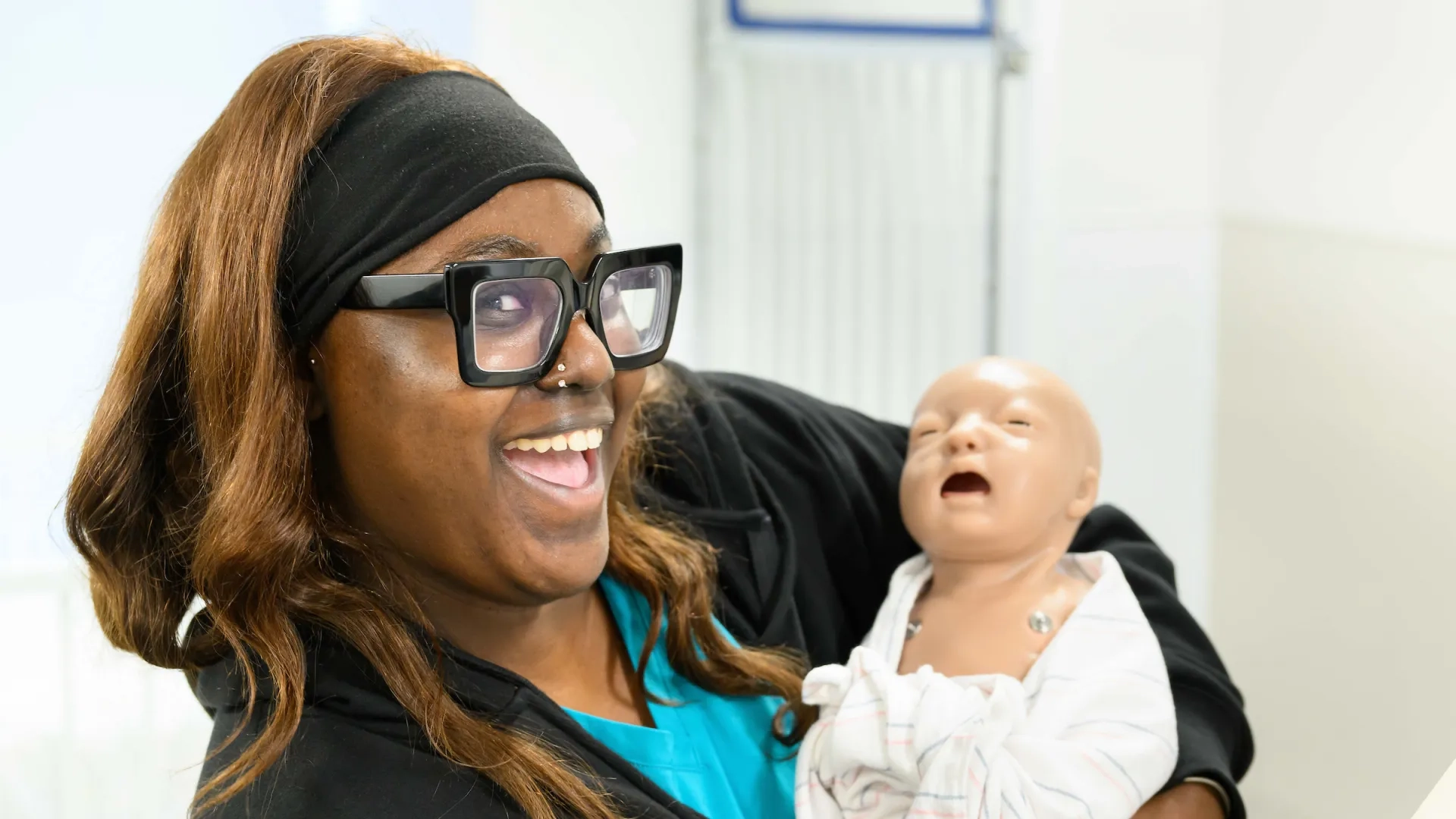 maternity nursing student with manikin
