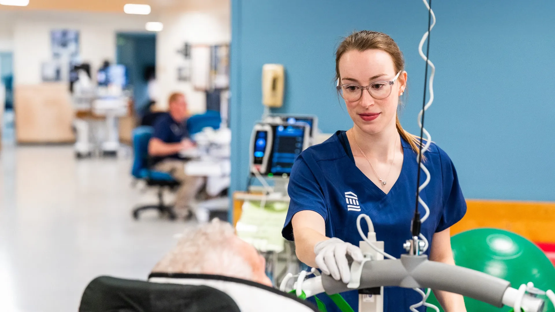 Rehab specialist working with a patient