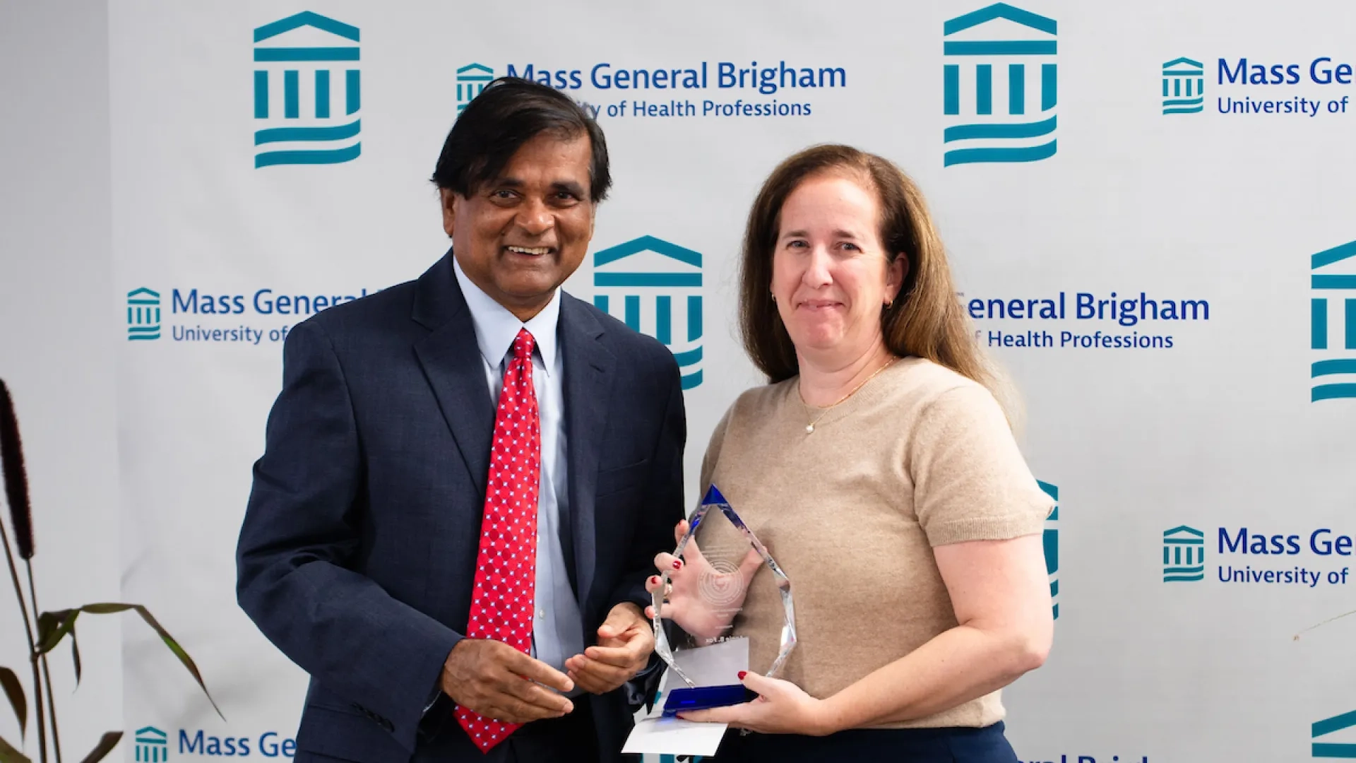man and woman holding award