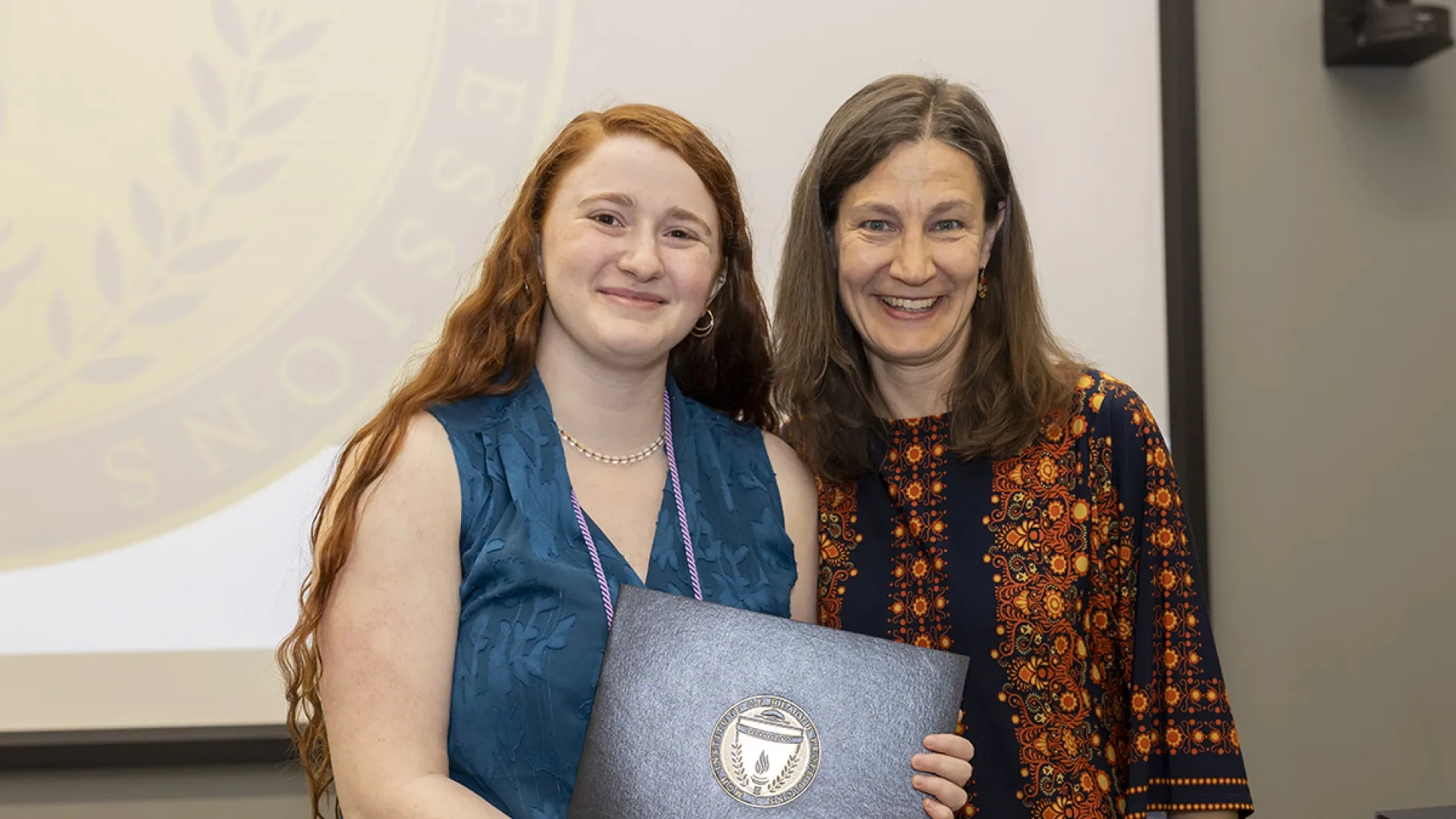 Helen Cohen and Lauryn Zipse pose with the Kenneth N. Stevens Student Research Award