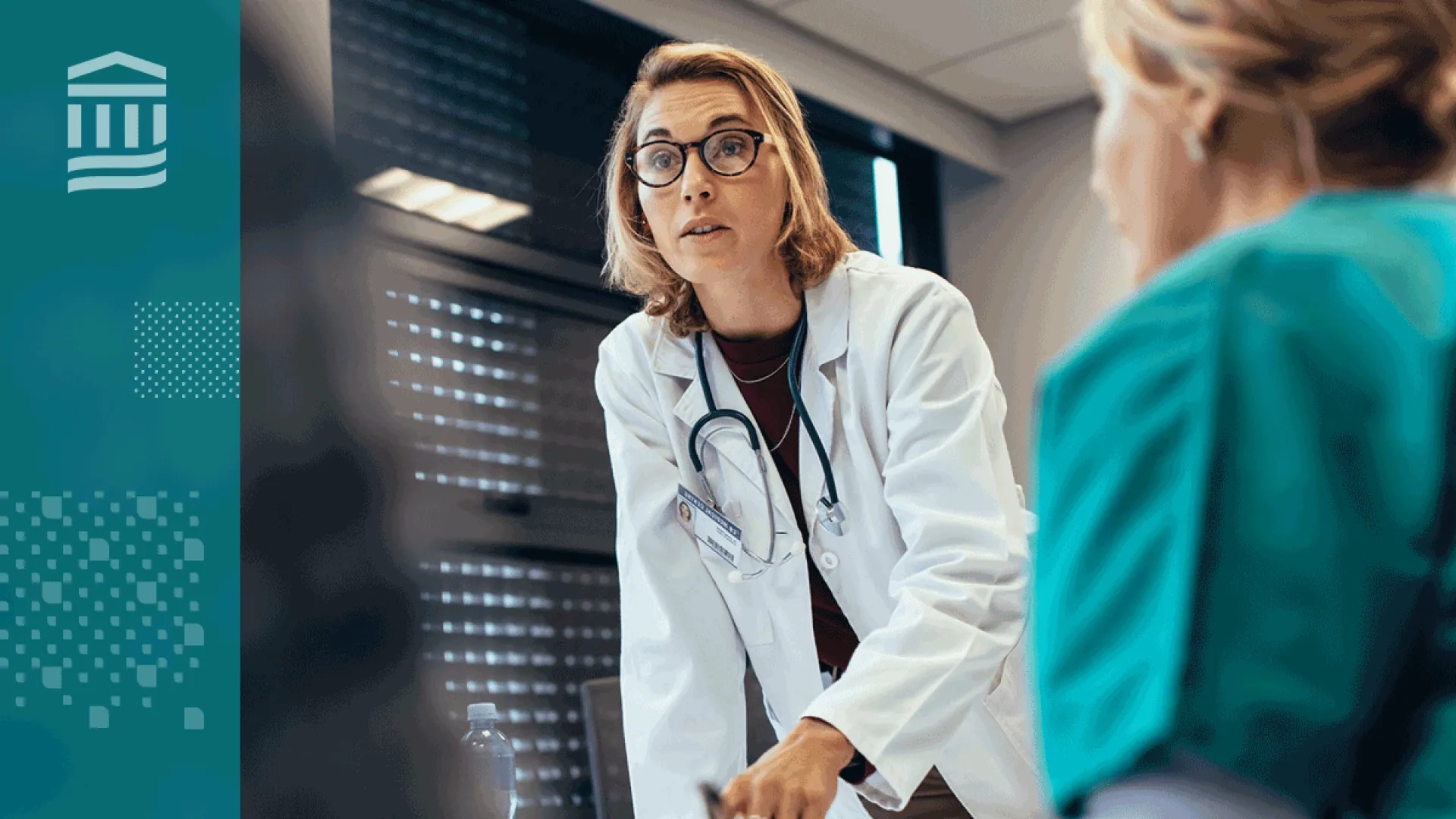 woman in white lab coat and stethoscope leads group of people - nearest one is in scrubs