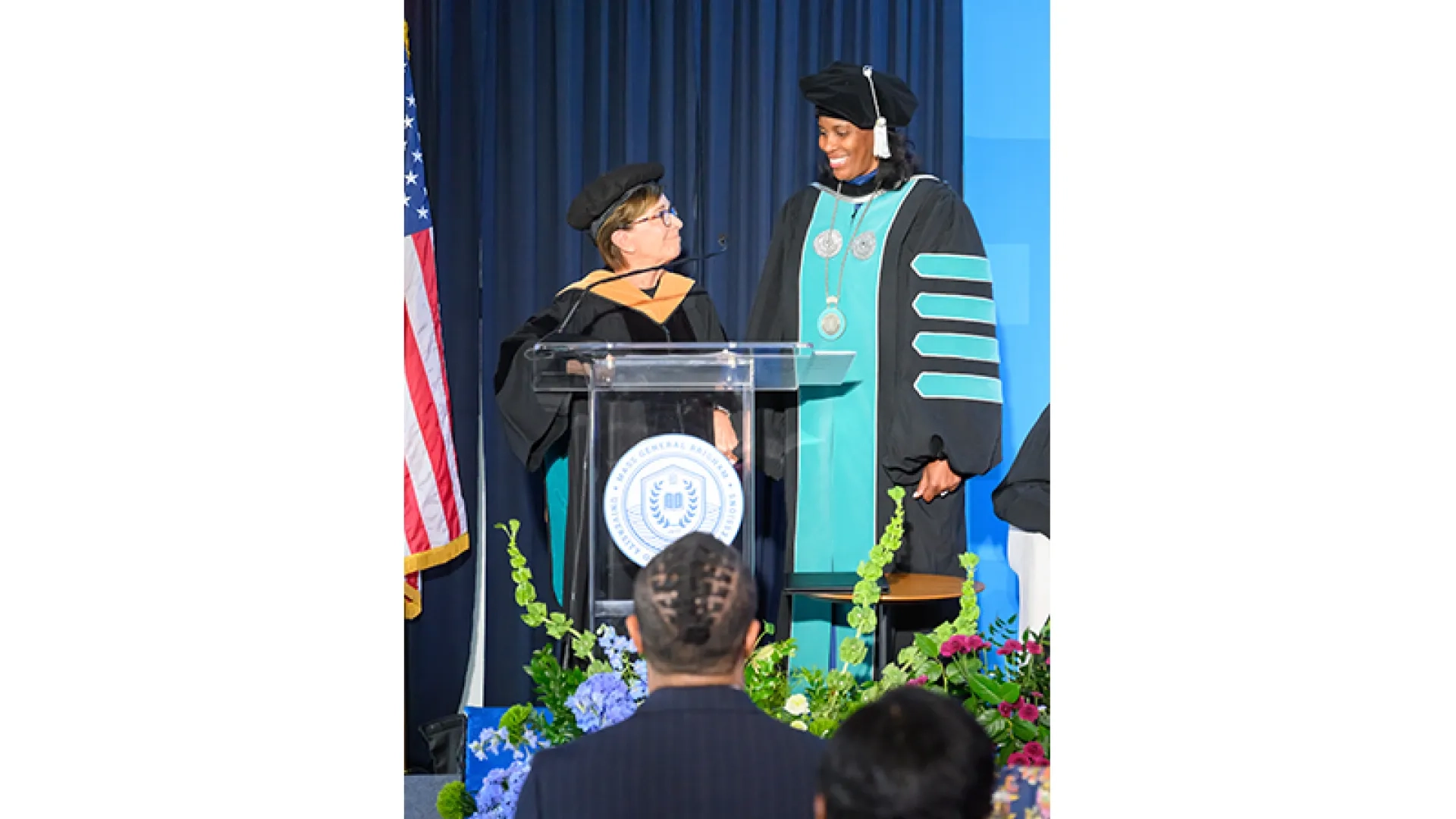 Chair Ives Erickson delivers the oath of office to President Jones. 