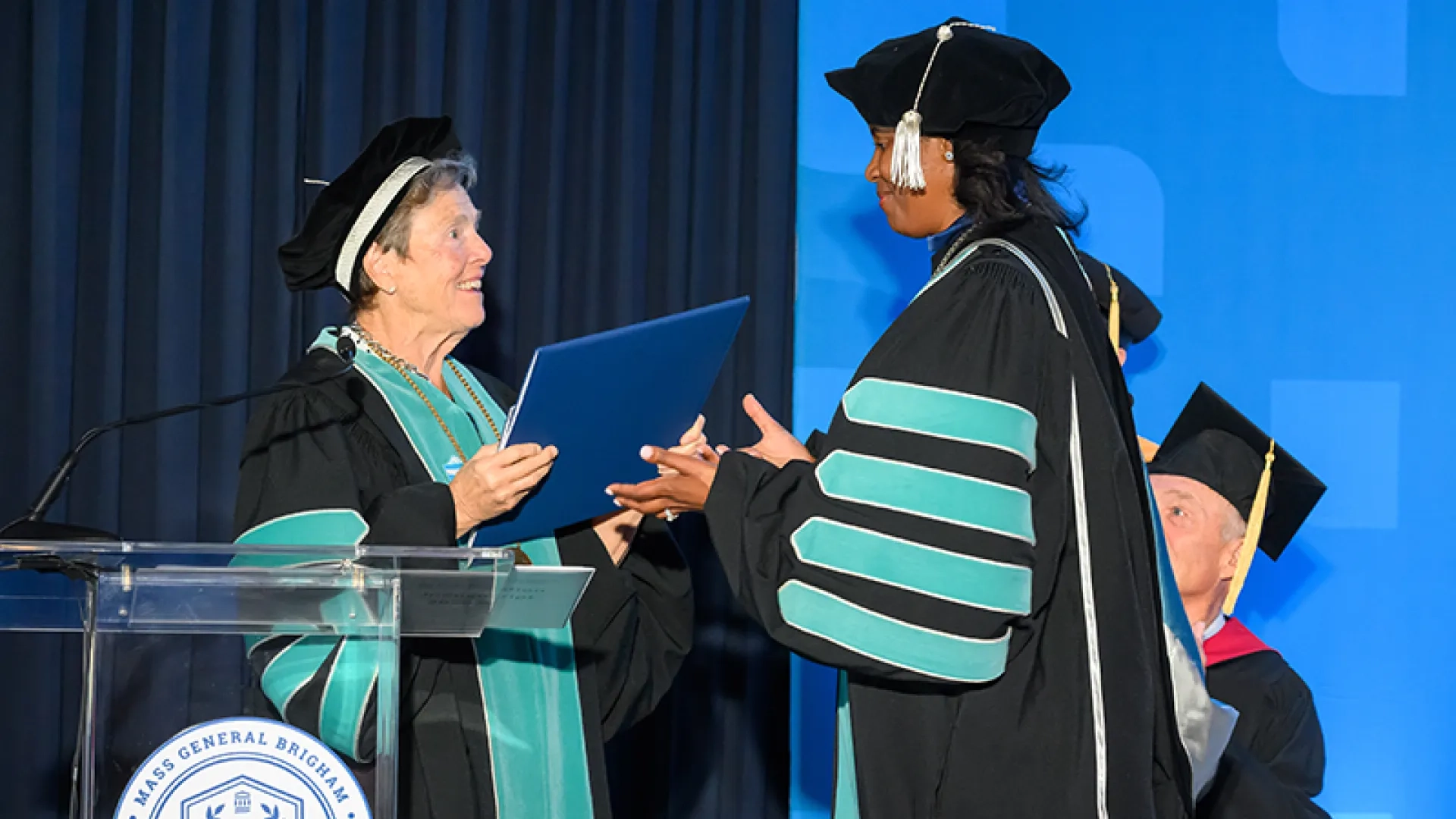 paula milone-nuzzo presents deborah jones with the university charter