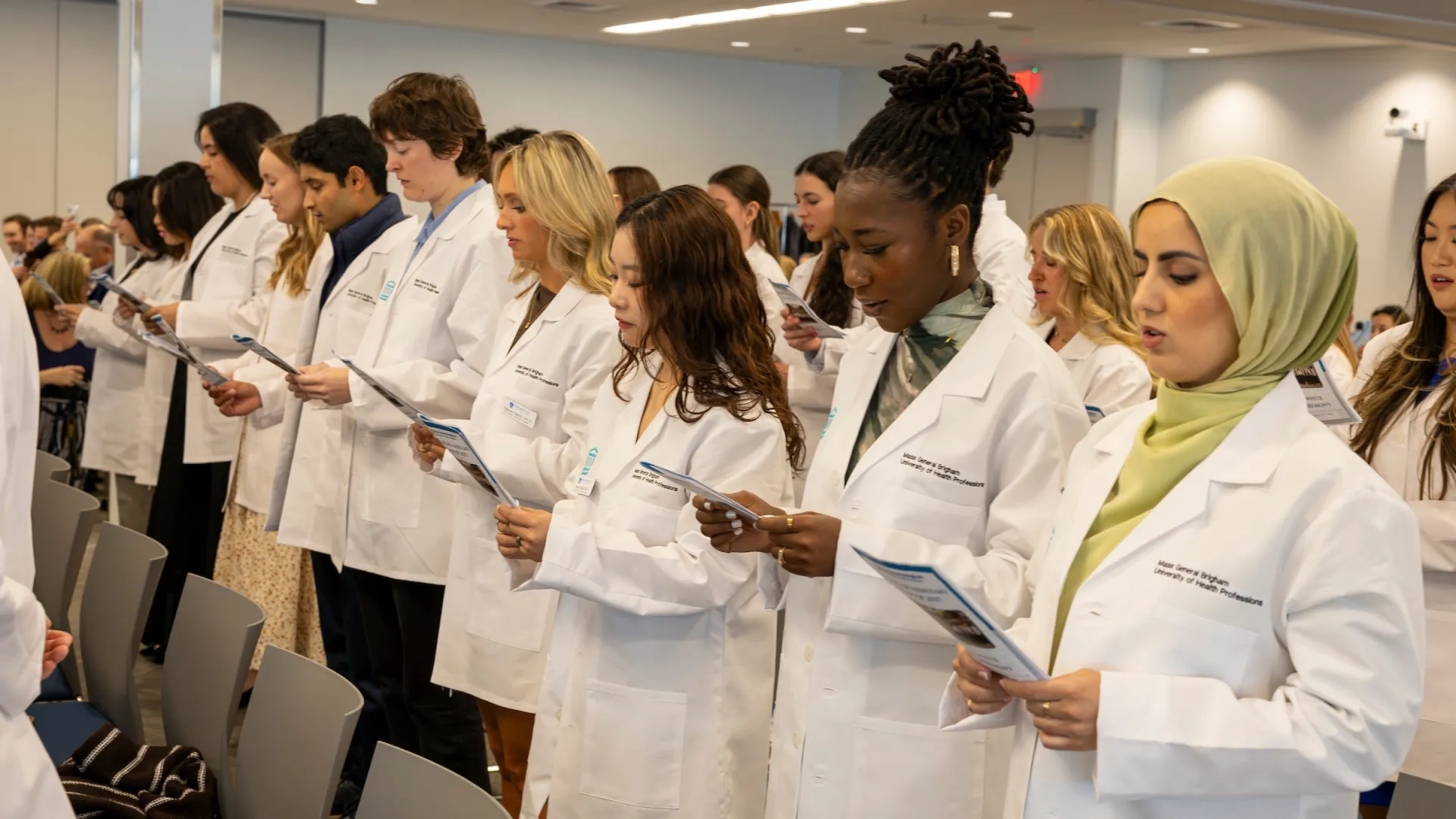 several people standing with white coats
