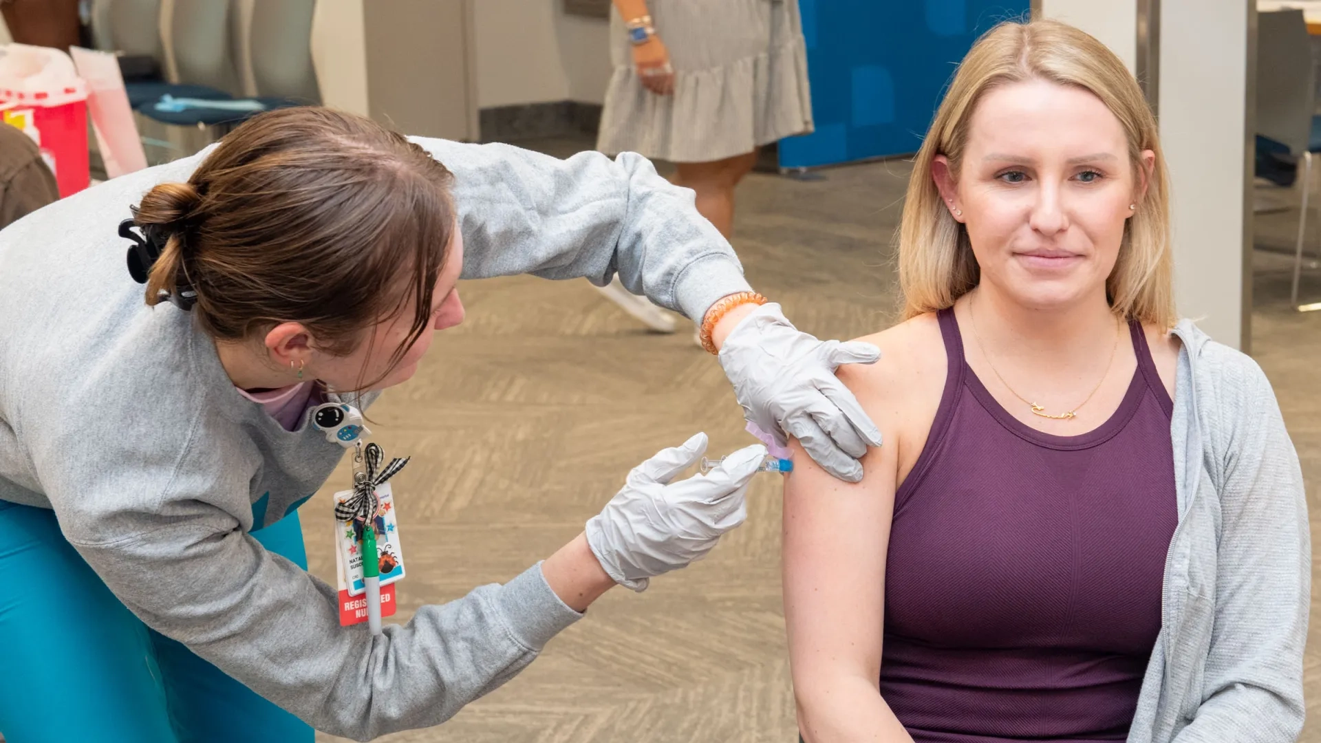 A woman receives a flu vaccination