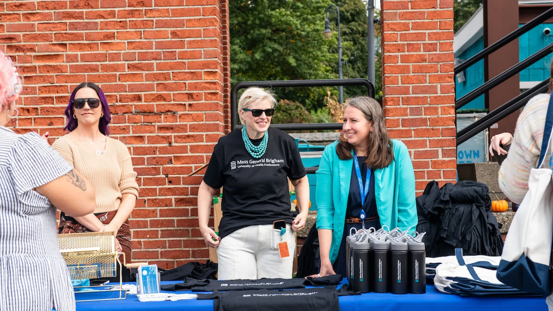 3 women behind a table