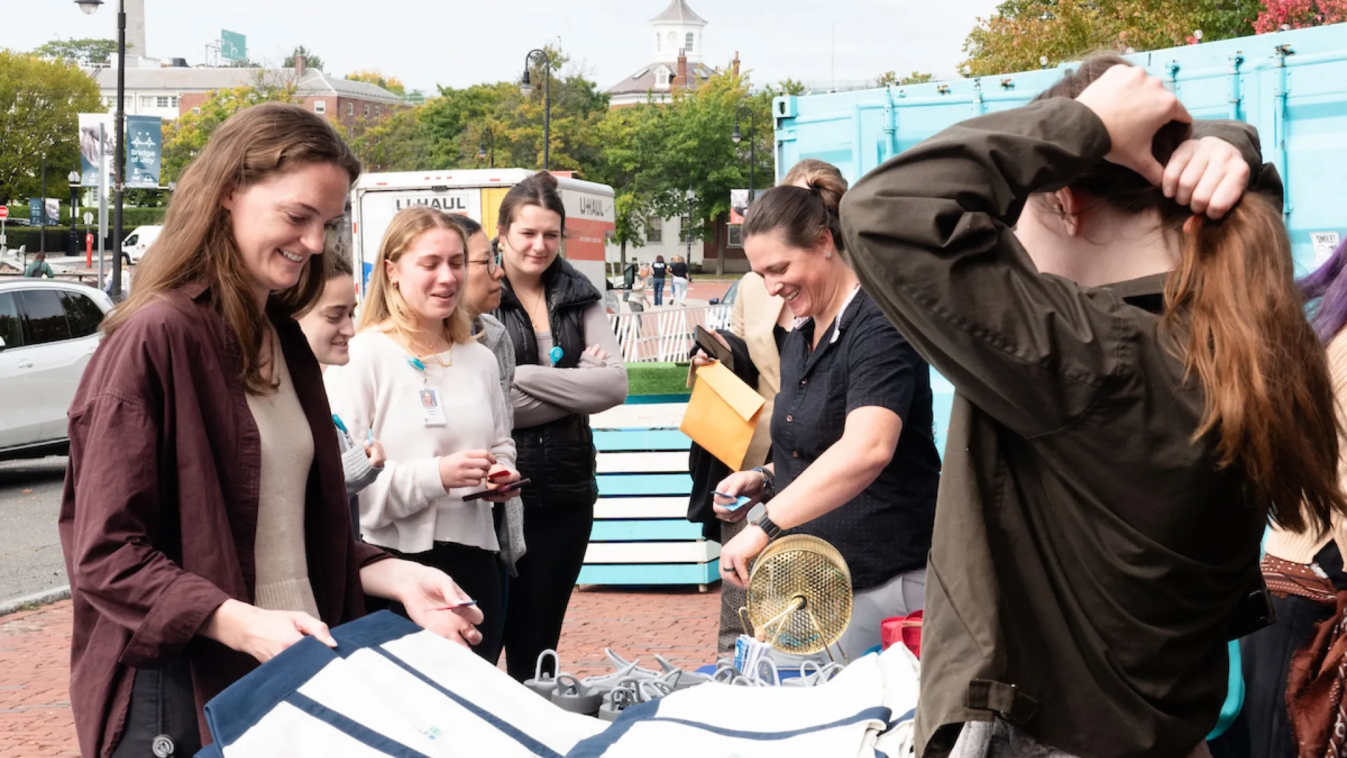 people smiling with free stuff
