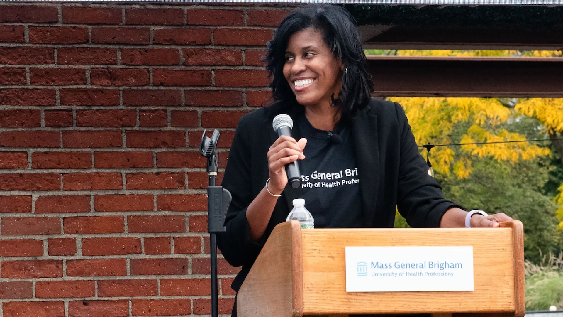 woman smiling at podium