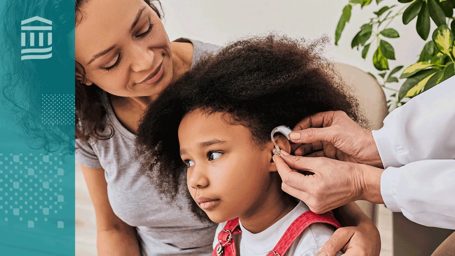 woman has arm around her daughter who is getting fitted for a hearing aid