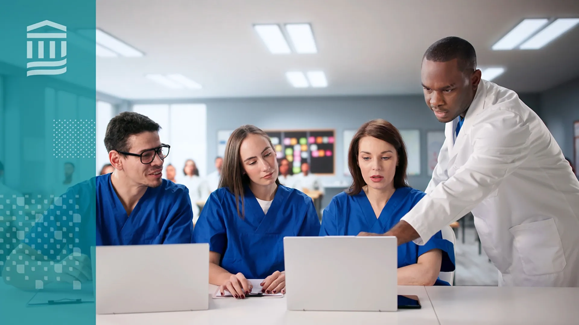 Nursing students work together in a classroom or simulation lab while reviewing a laptop, with an instructor nearby guiding the discussion. 