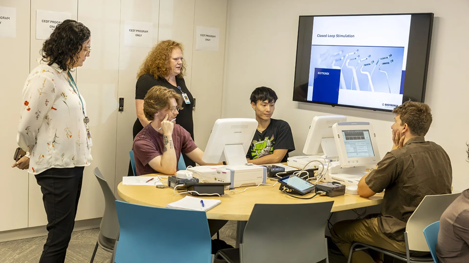 Students in the Cardiac Electronic Device Technician program work in a lab