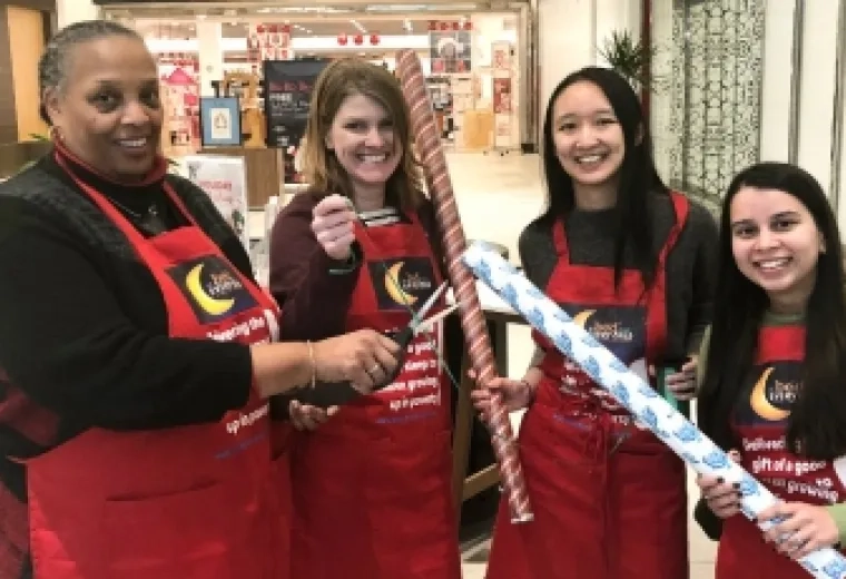 Joan Blue, Luella Benn, Lindsey Lo, and Arwa Jivanjee were among the IHP staffers who wrapped presents at CambridgeSide Galleria.