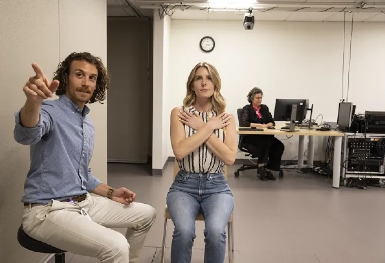 Doctor of Occupational Therapy students and researchers doing patient assessment techniques in a clinical lab setting with monitoring equipment.