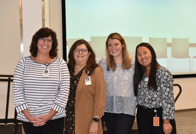 Pauline Fiorello, Certified Brain Injury Specialist and OT Instructor, Dr. Mary Hildebrand, Associate OT Professor and Founding Director of the OT CLiPR, and OT doctoral students Jillian Yamartino and Alexandra Podell stand together after Grand Rounds.